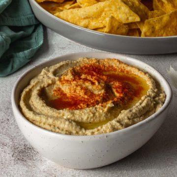 Bowl of Hummus sprinkled with paprika.