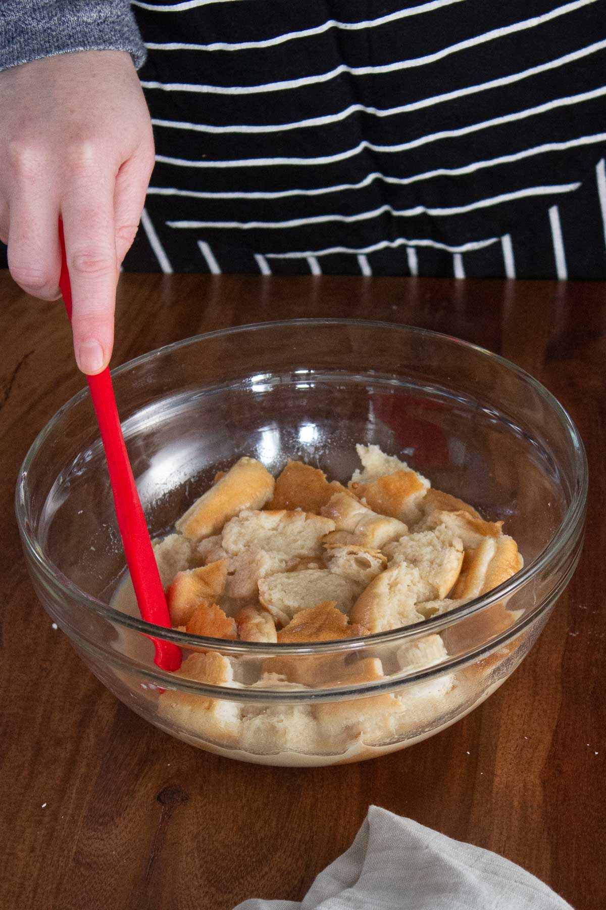 Bread soaking in the milk and sugar