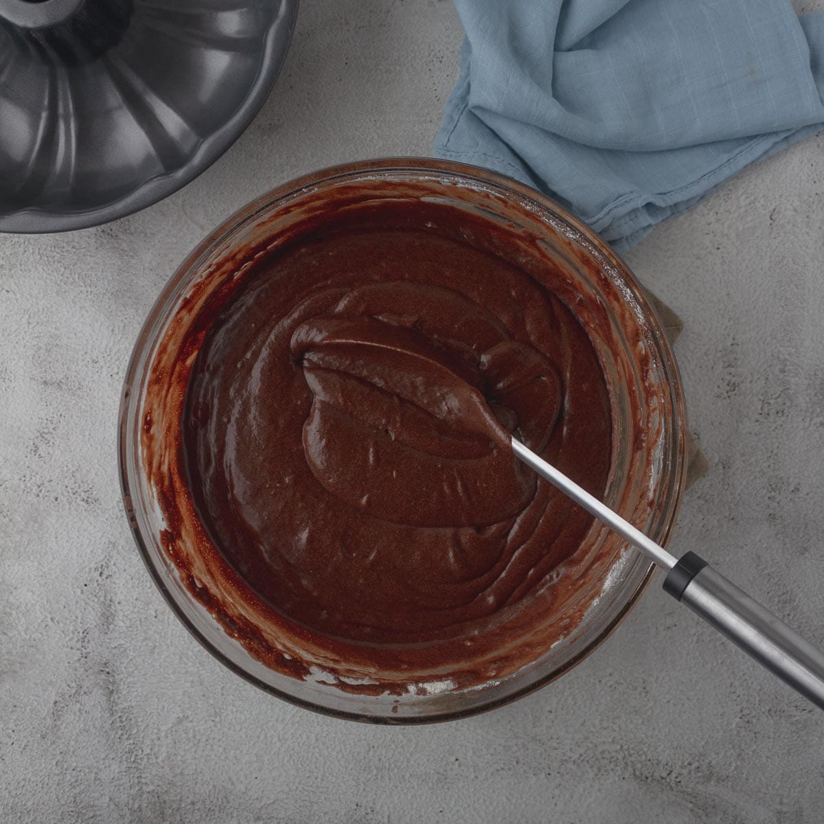 Chocolate bundt cake batter in a mixing bowl.