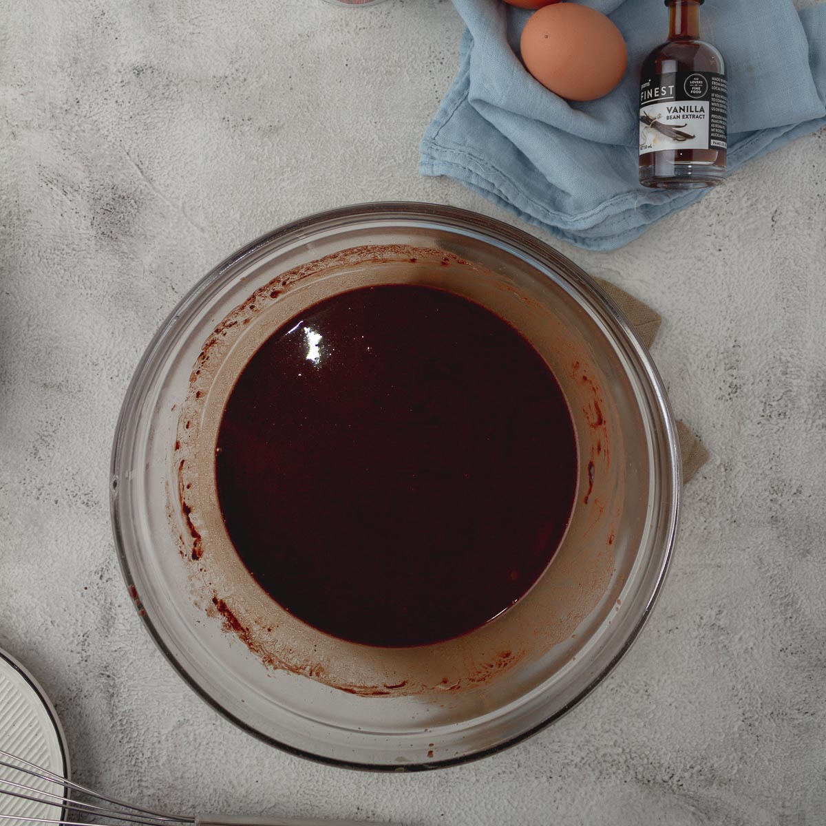 Cocoa Butter, Butter and Hot Coffee in a mixing bowl.