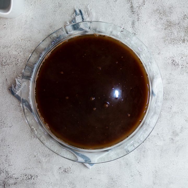 Boiling water poured over pudding batter