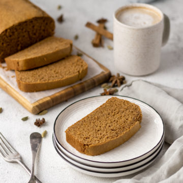 Sliced Dutch Breakfast cake with a cup of coffee.