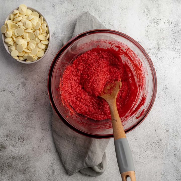 Red Velvet Cookies Step 2  - Eggs, vanilla, red food colouring mixed into the creamed butter and sugar