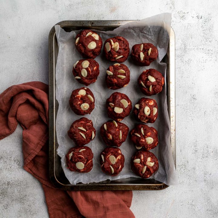 Red Velvet Cookies Step 4 - Cookie dough divided into 100 gram balls on a baking sheet