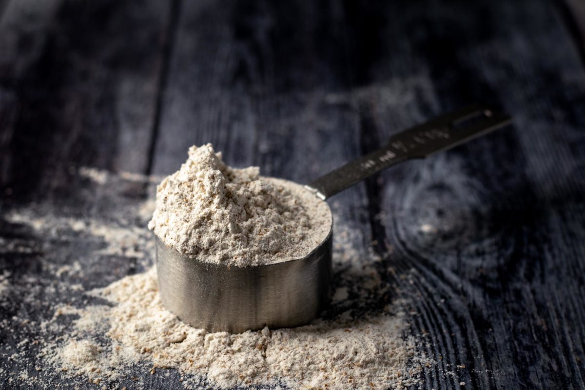 A cup measure holding flour