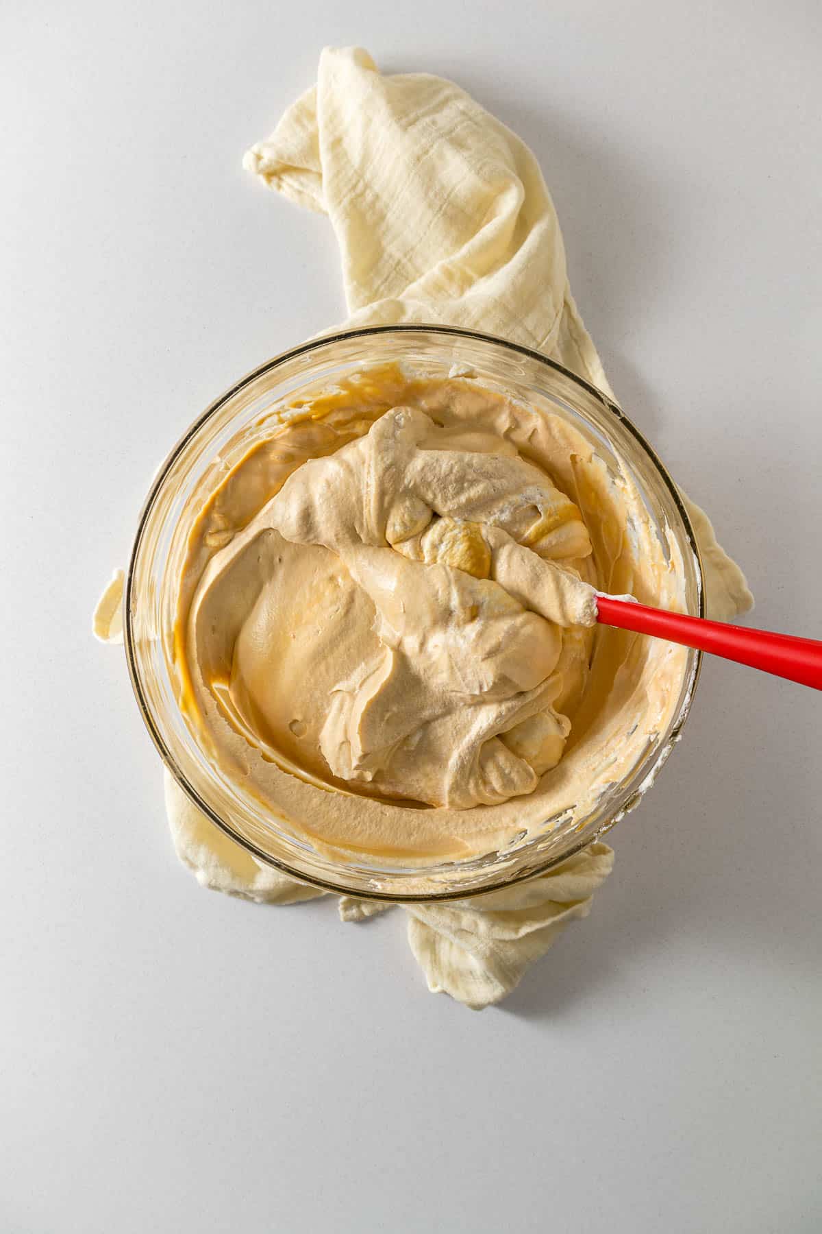 Step 2 - Caramel folded into the cream in a large mixing bowl.