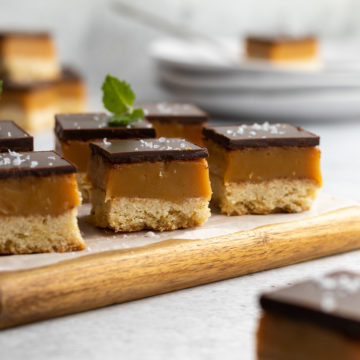 Peppermint crisp caramel slices on a board.