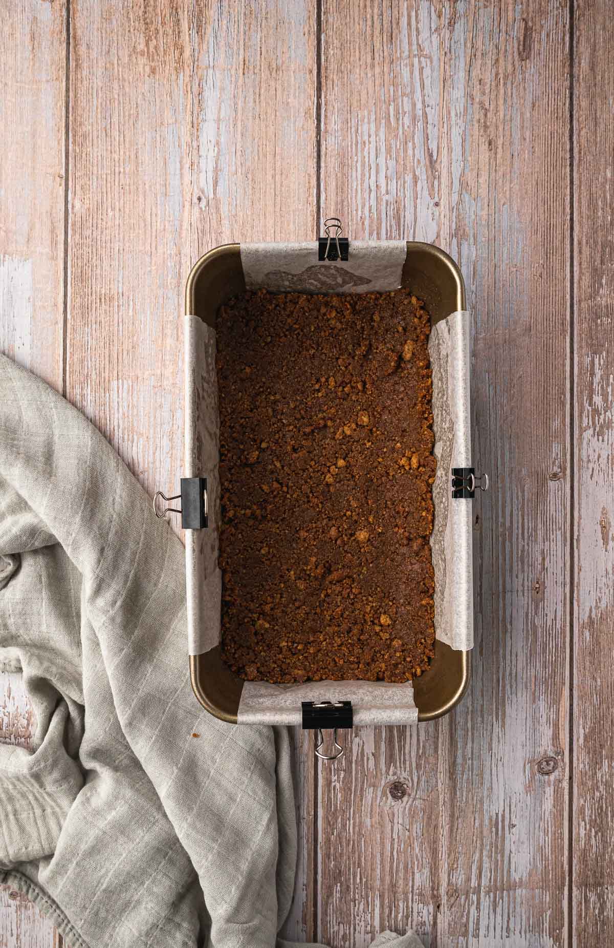 Biscuits pressed into the bottom of a loaf tin