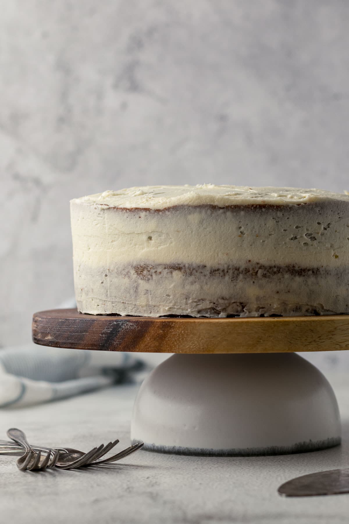 Carrot cake with cream cheese icing crumb coat.