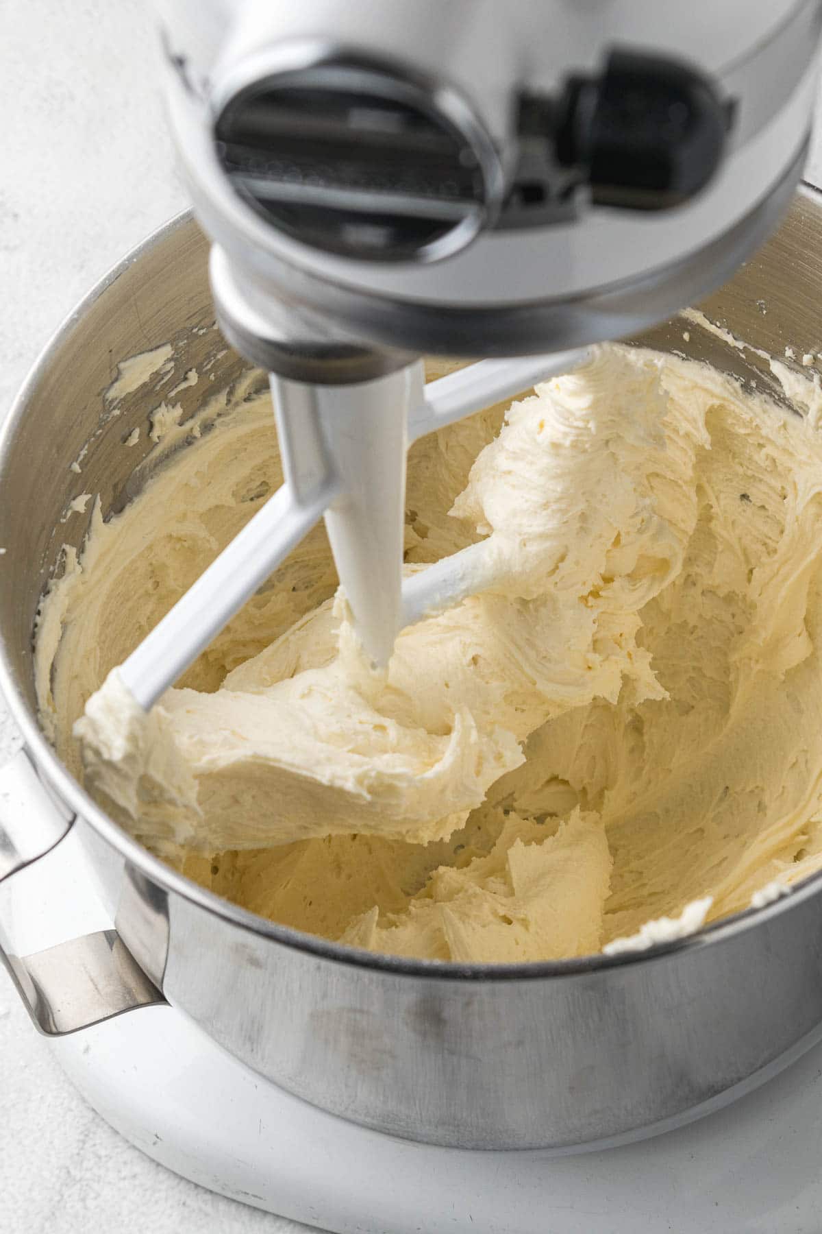 Cream cheese icing in a bowl with paddle attachment