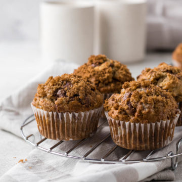 Banana Walnut Chocolate Chip Muffins on a cooling rack.