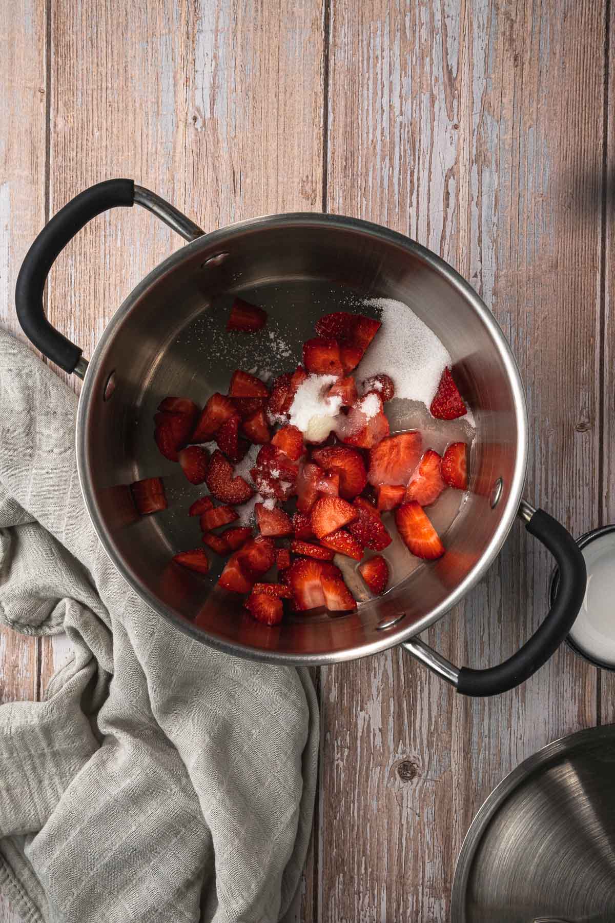 Strawberry compote ingredients in a pot before cooking