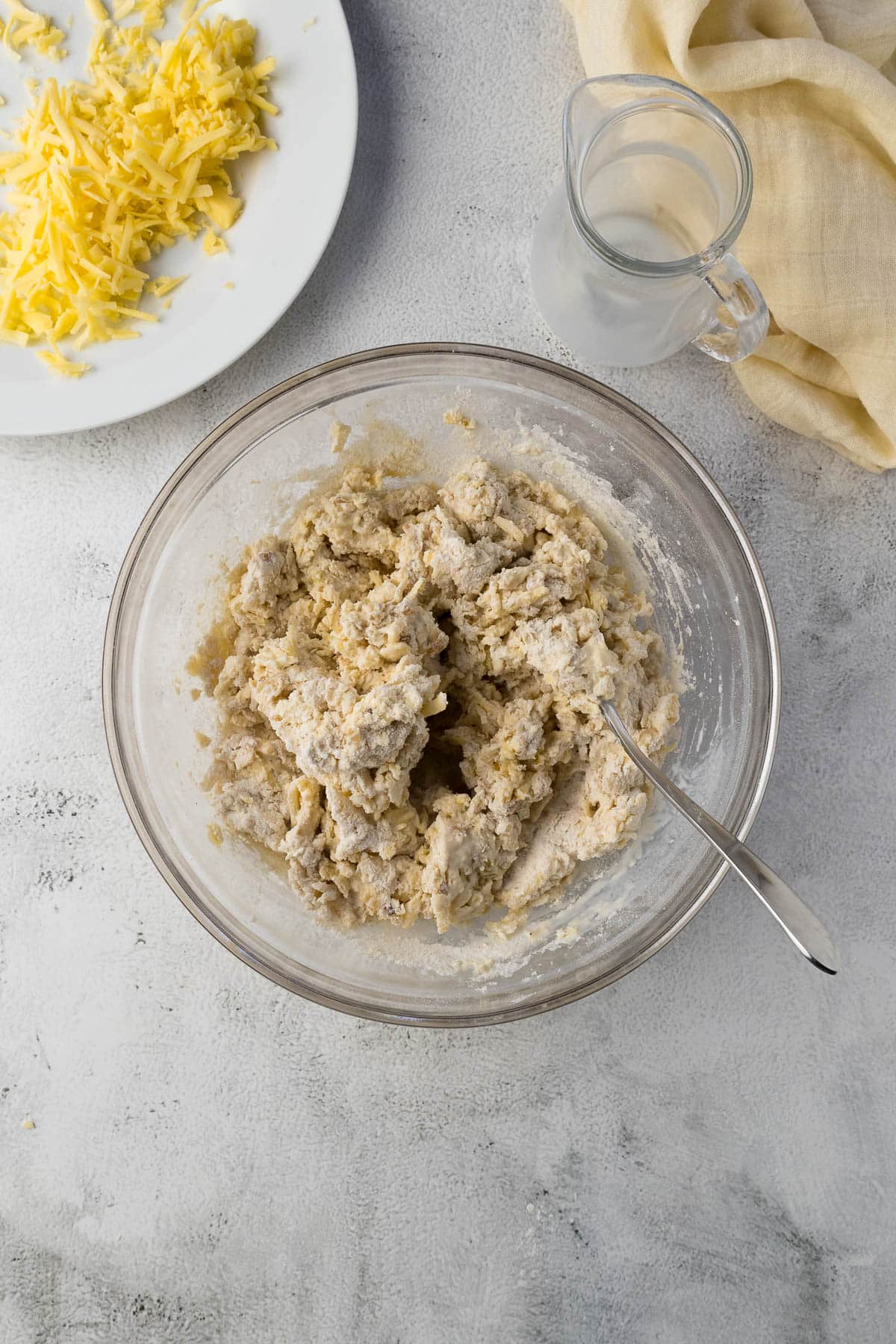 Step 6 -Rough, shaggy scone dough in a bowl.