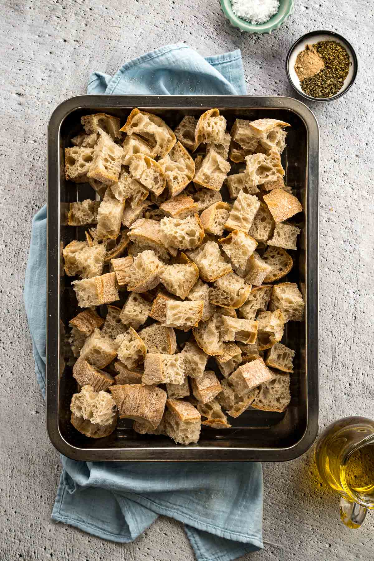 Step 2 - Cubed bread in a baking dish.