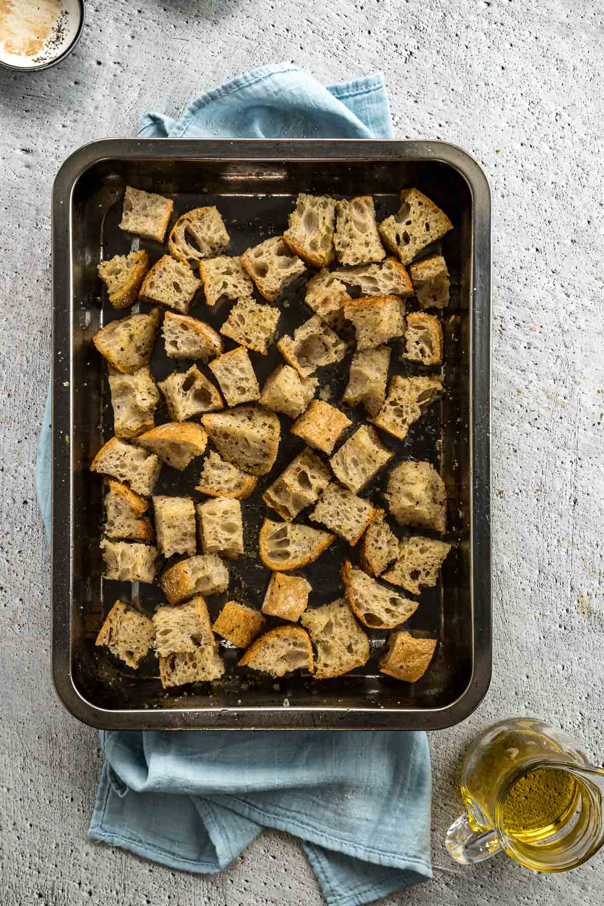 Step 3 - Seasoned cubed bread in a single layer in baking dish.