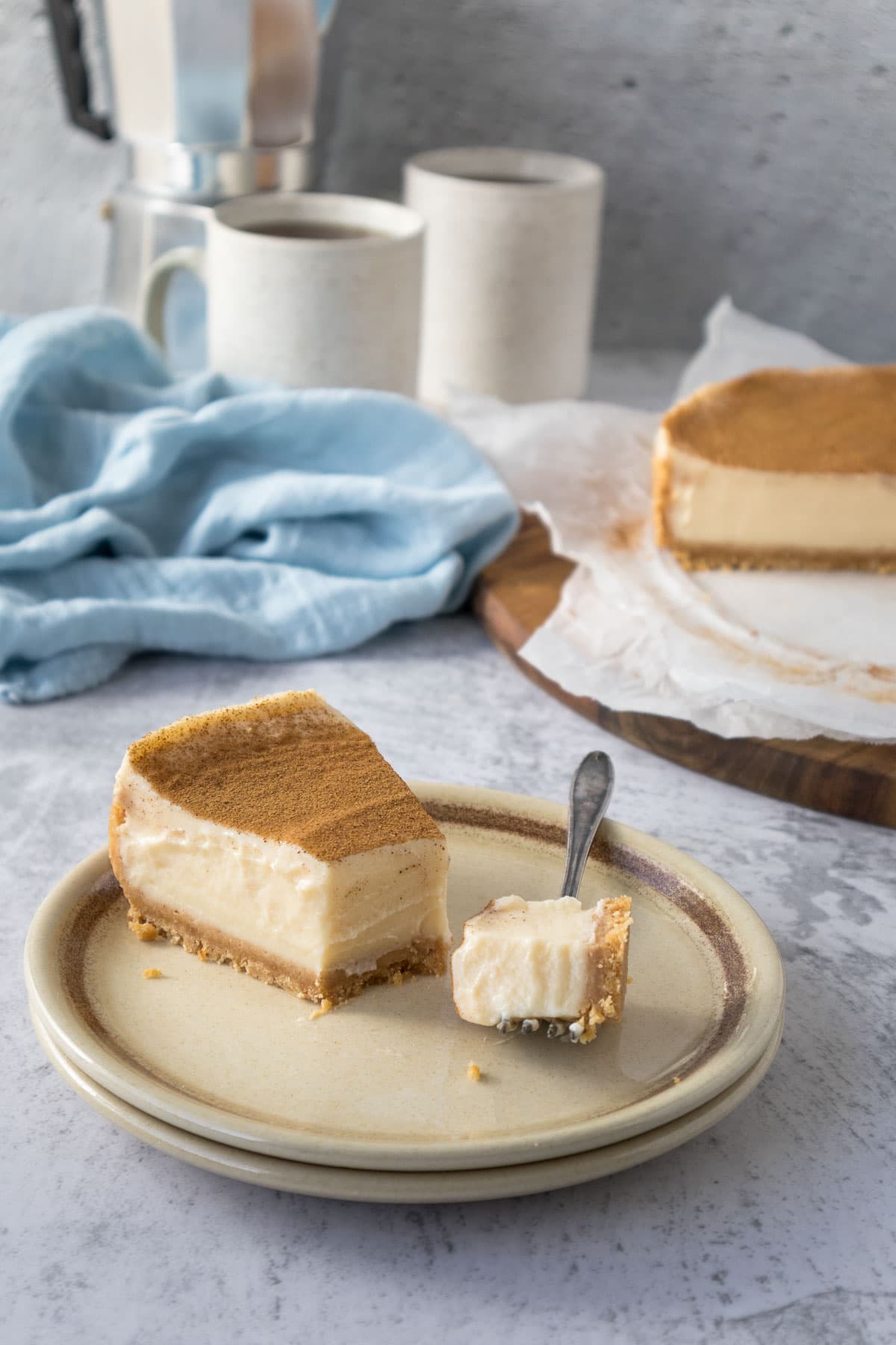 Slice of milk tart on a plate with a piece on a fork.