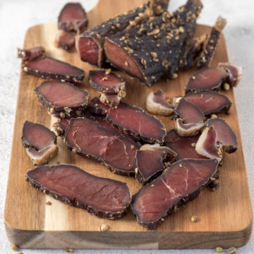 Sliced biltong on a board.