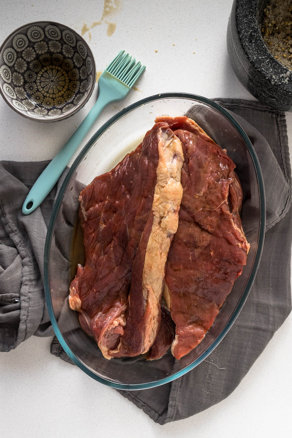Meat slices brushed with the vinegar mix.