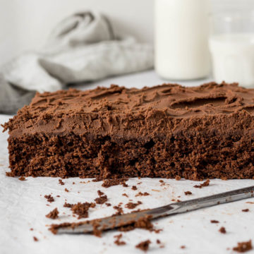 Sliced chocolate tray bake showing milk chocolate ganache.