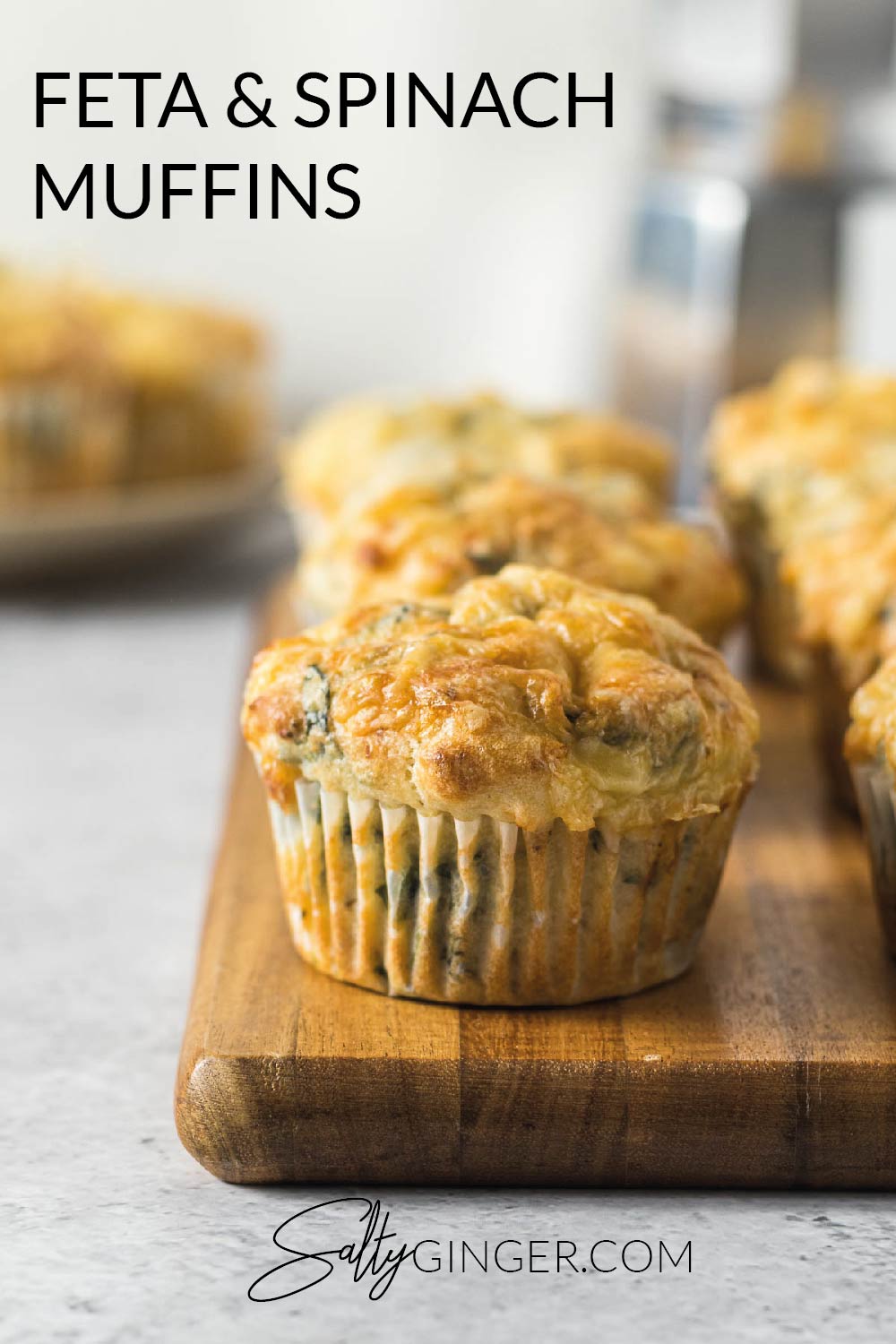 Feta and spinach muffins on a board.