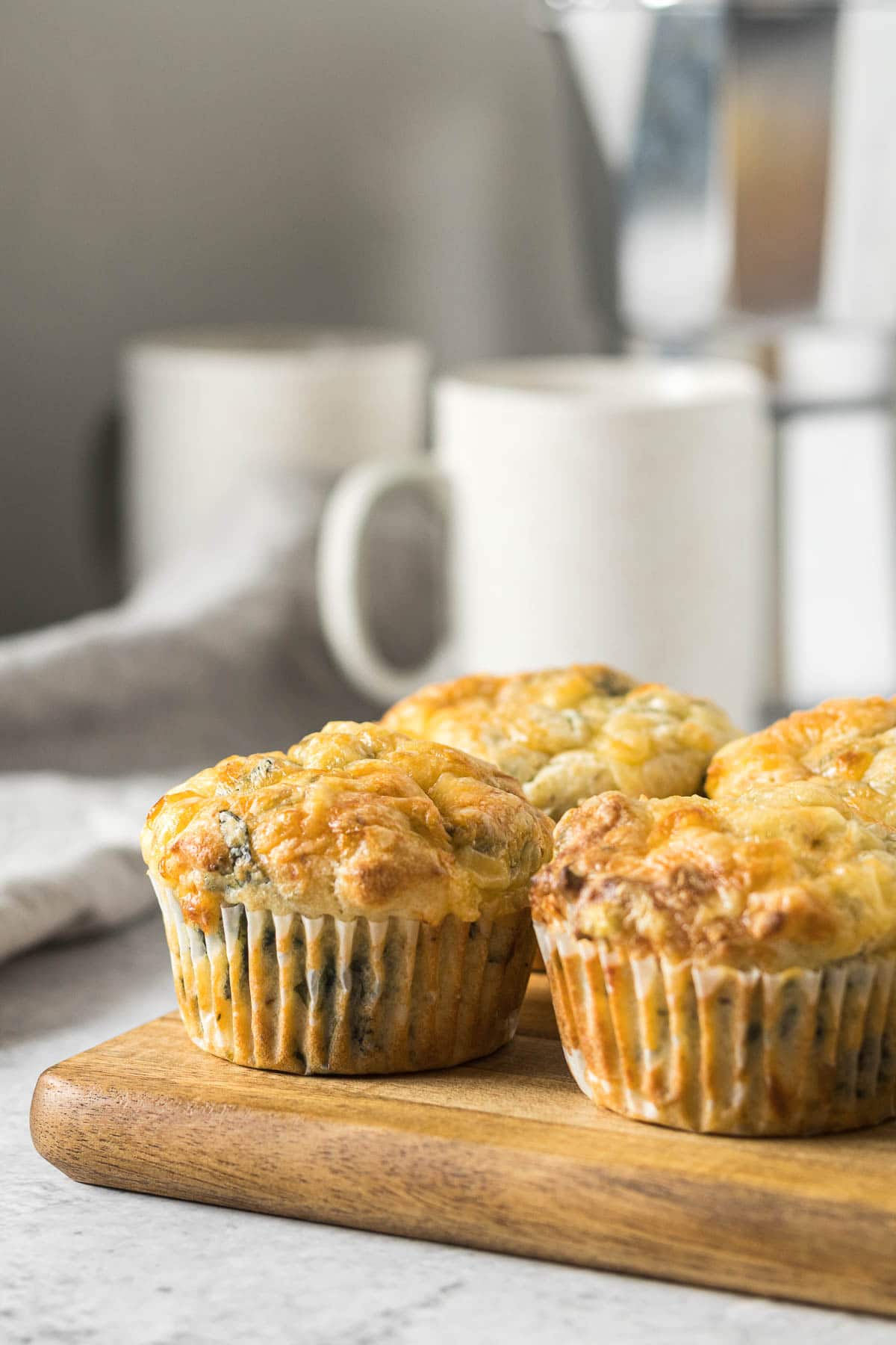 Feta and spinach muffins on a platter.