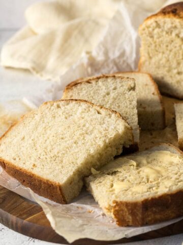 Slices of potbrood on a cutting board.