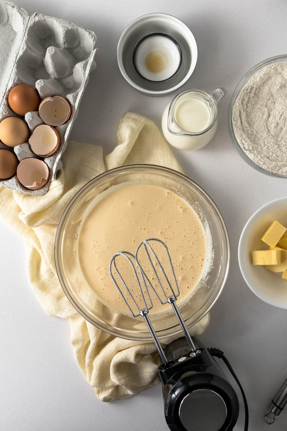 Beaten eggs and sugar in a mixing bowl.
