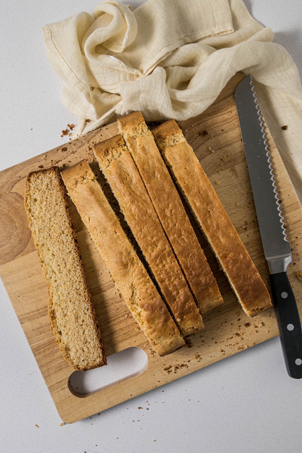 Step 7 - Condensed milk rusks being sliced for drying.