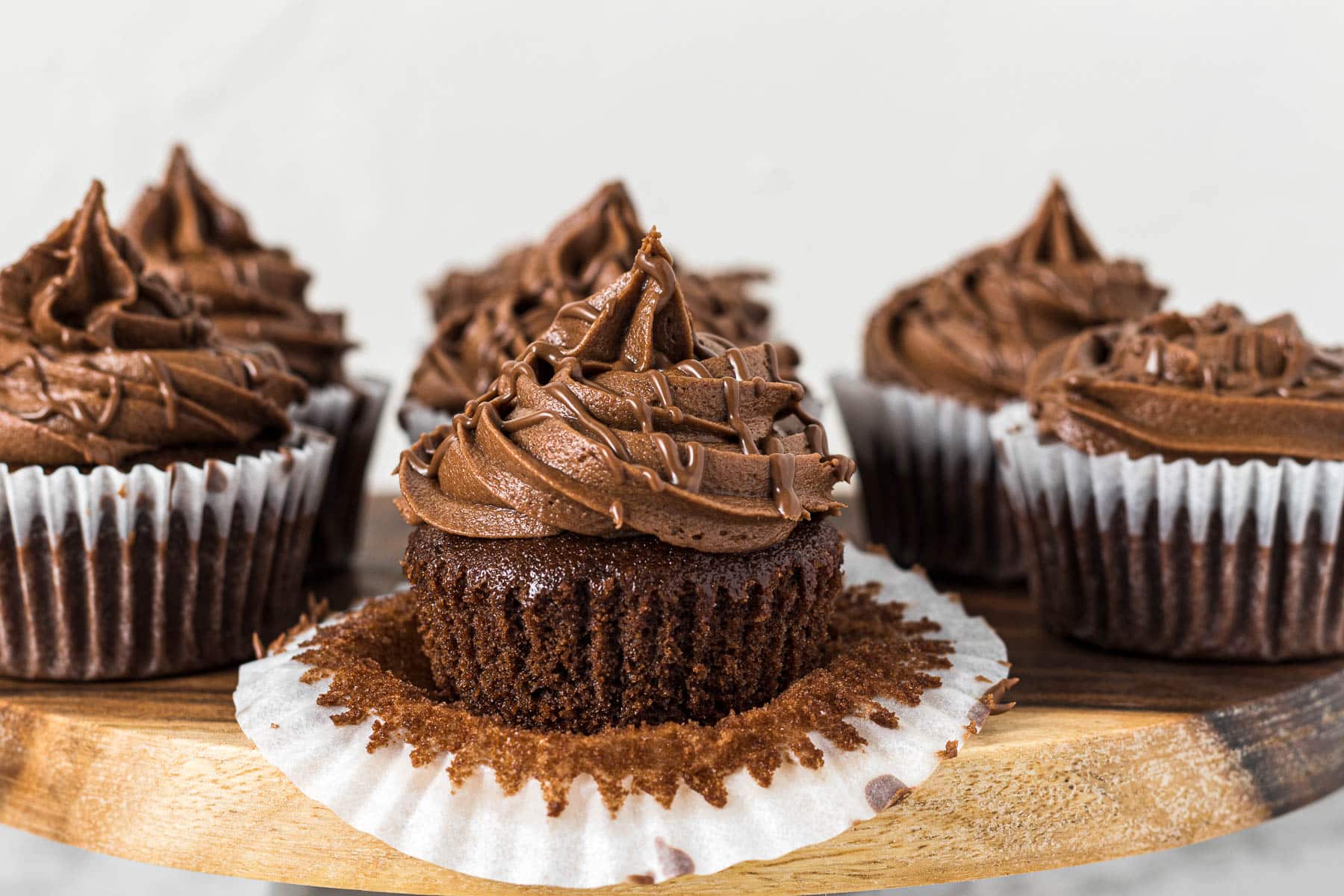 Frosted nutella cupcake with a Nutella drizzle.