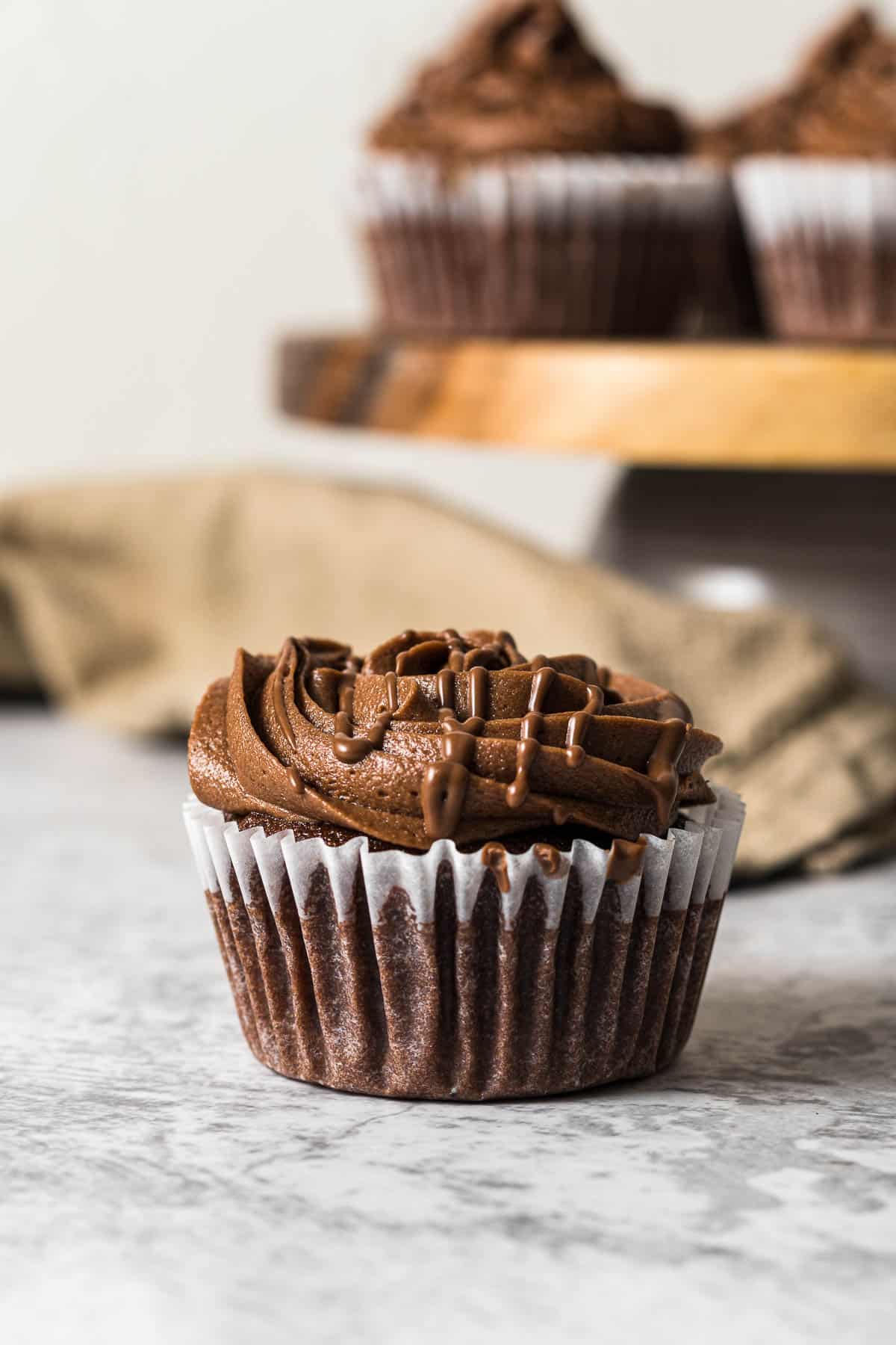 Frosted nutella cupcake with a Nutella drizzle.