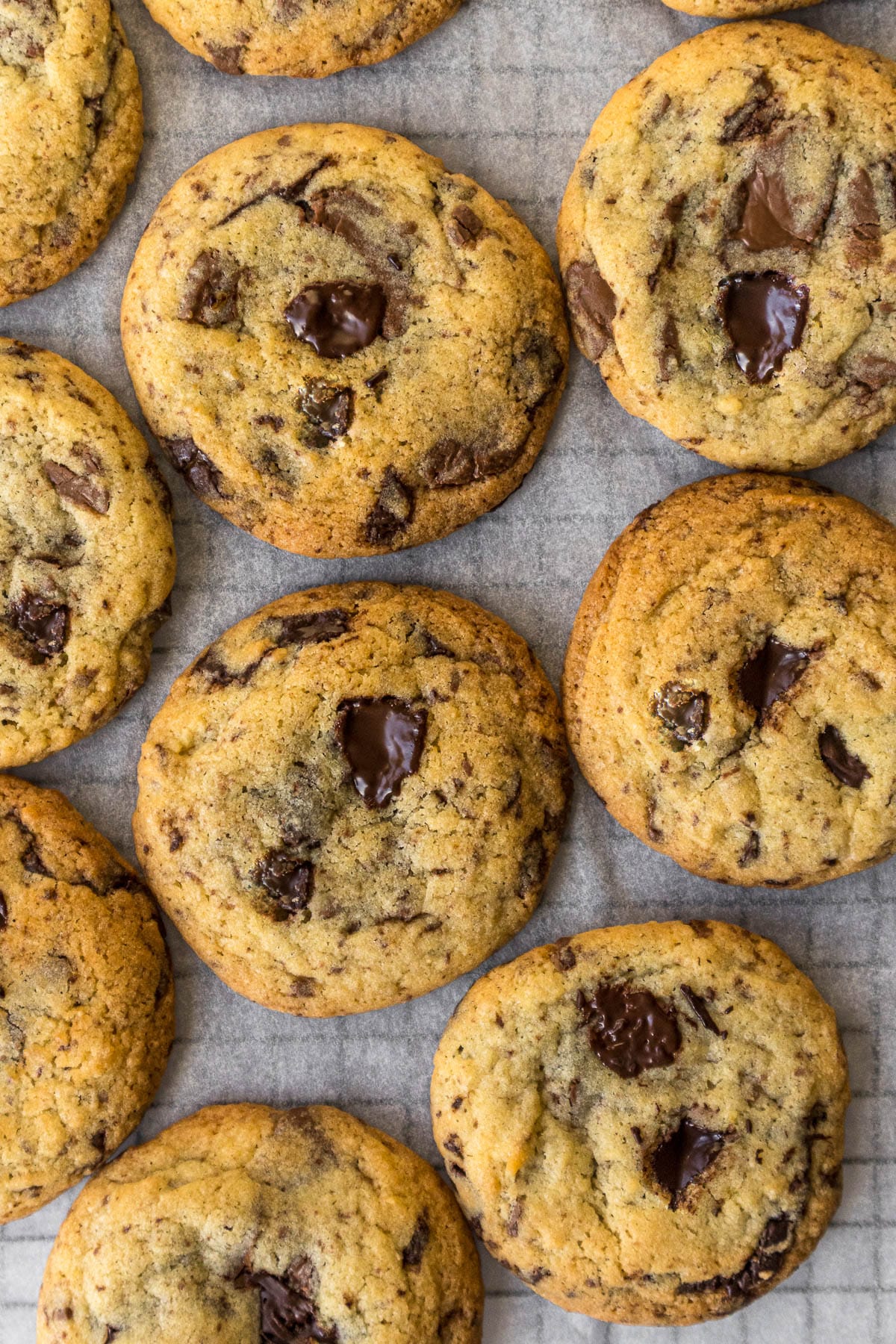 Chocolate chip cookies on a cooling rack.