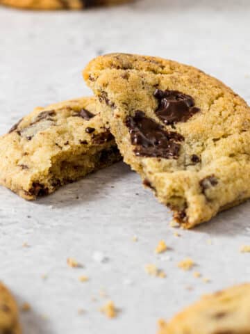 Chocolate chip cookies without brown sugar broken in half.