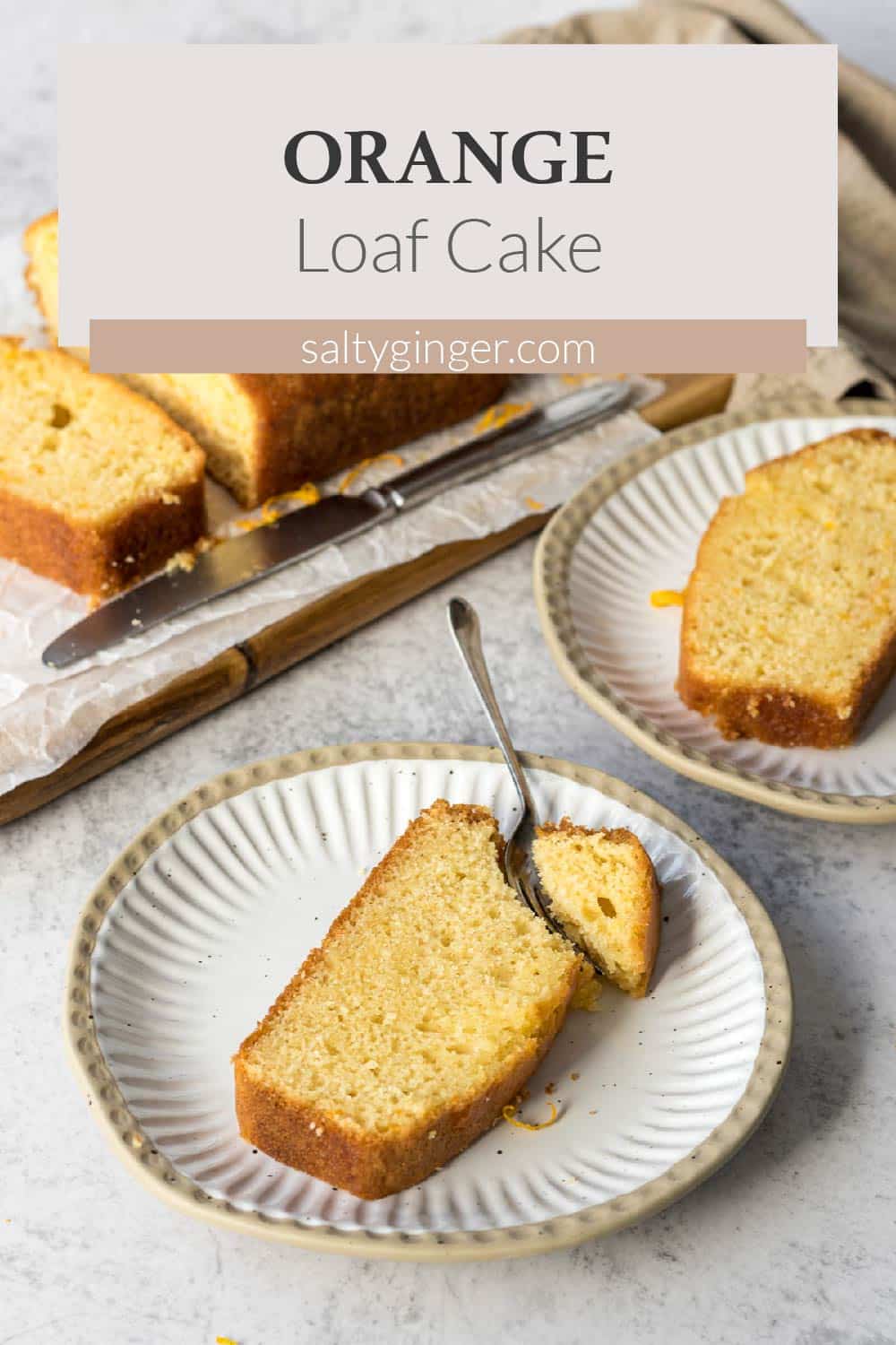 Sliced orange loaf cake on a plate.