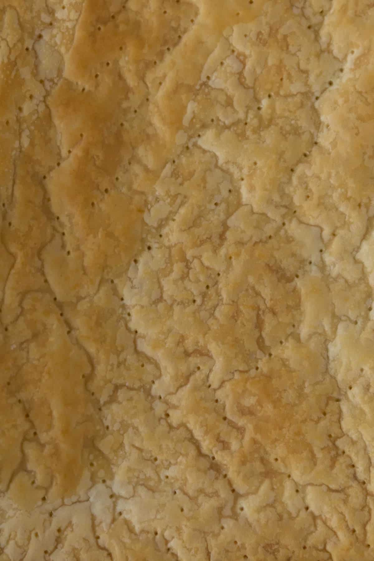 Puff pastry ready to be placed into cake tin.