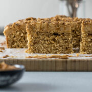 Sliced Biscoff cake on a board.