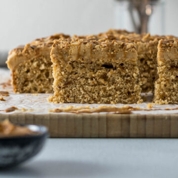 Sliced Biscoff cake on a board.