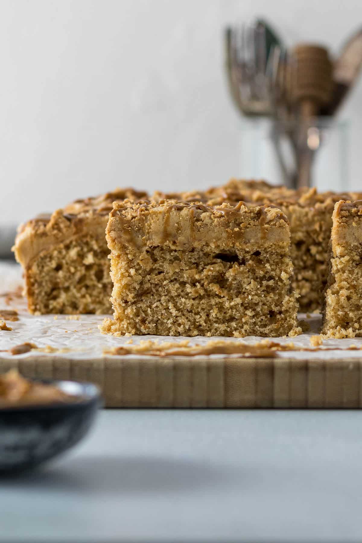 Sliced Biscoff cake on a board.