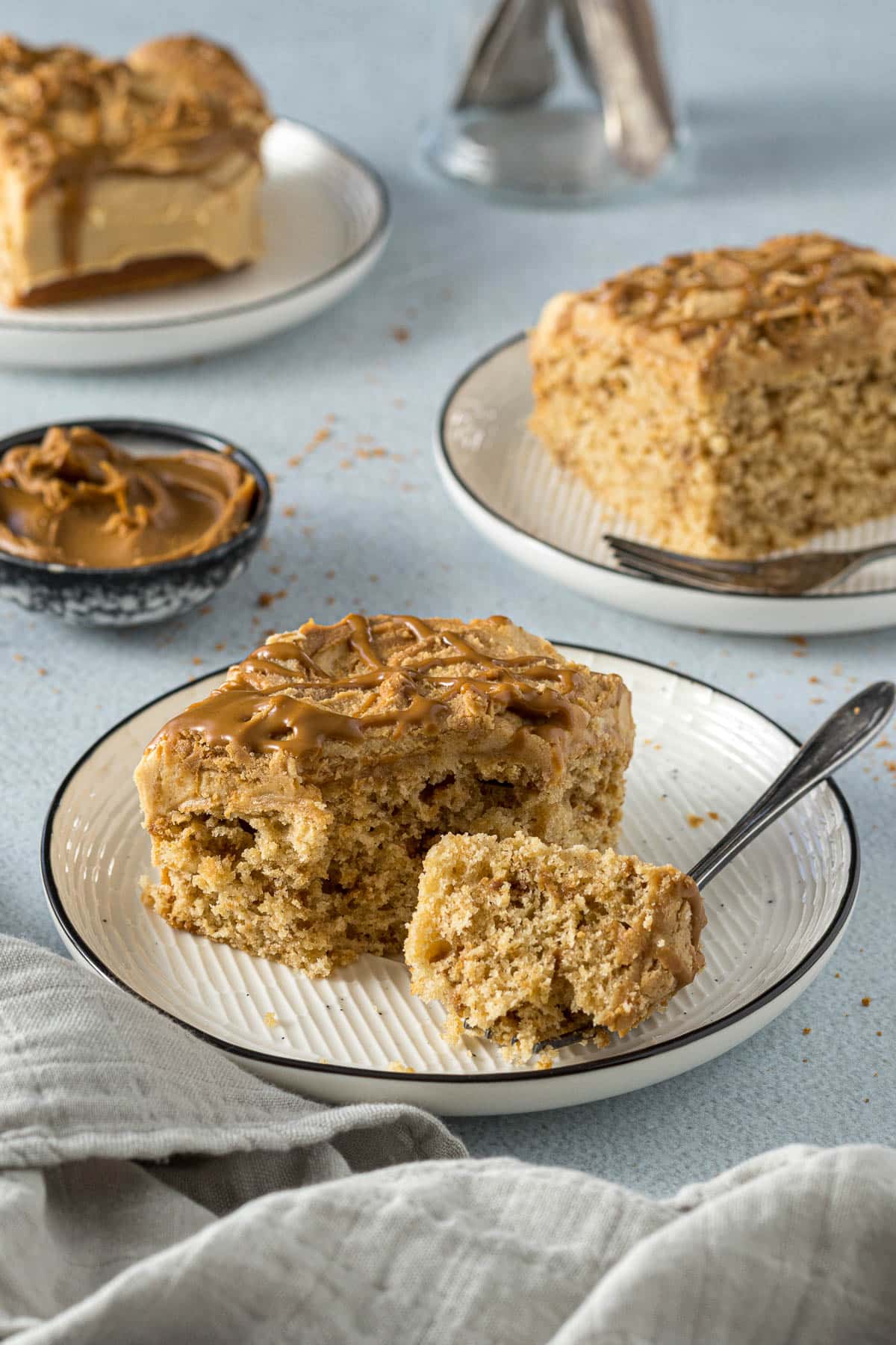 A slice of Lotus Biscoff tray bake cake on a plate.
