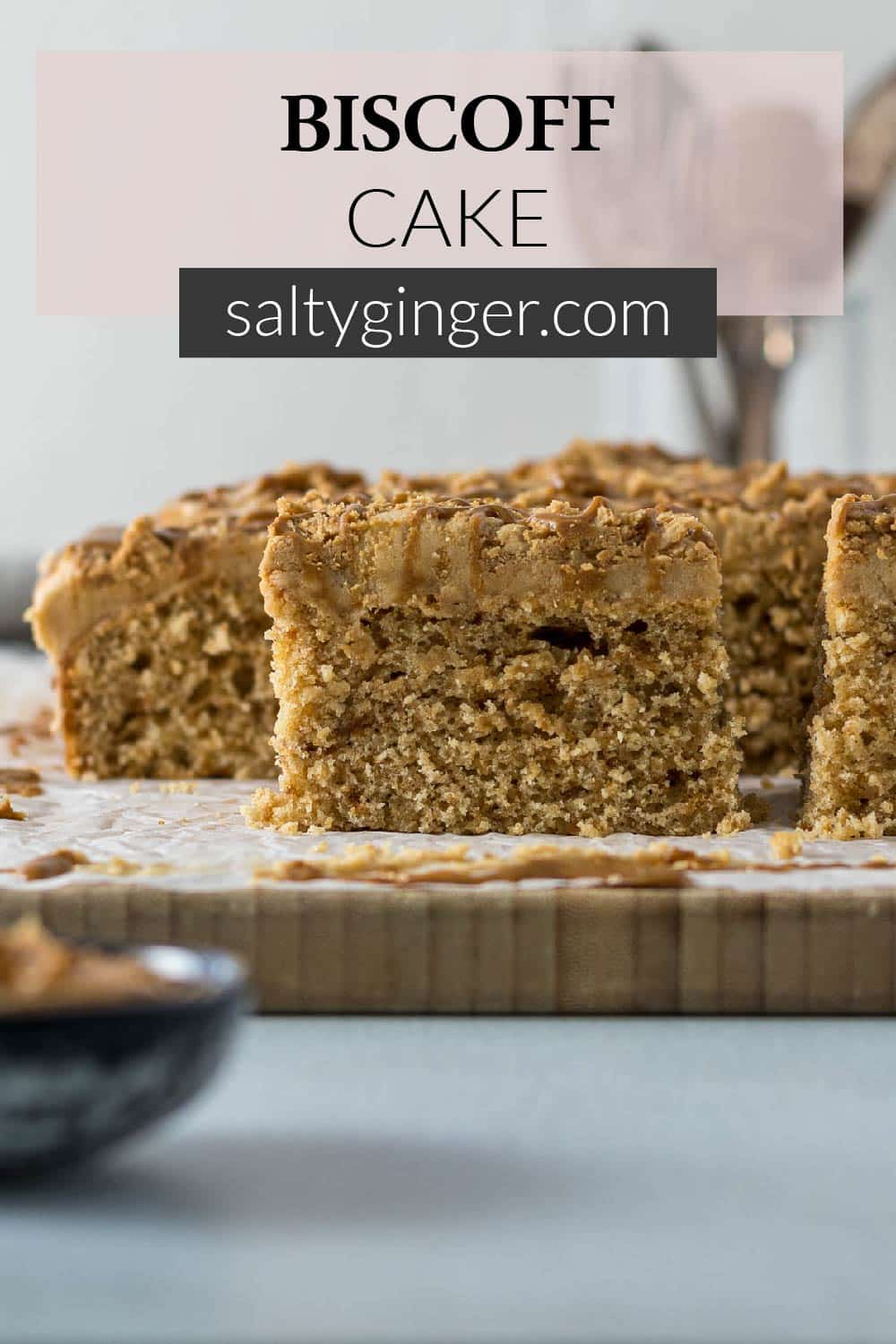 Pin - A slice of Lotus Biscoff tray bake cake on a plate.