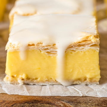 Vanilla custard slice topped with an icing glaze.