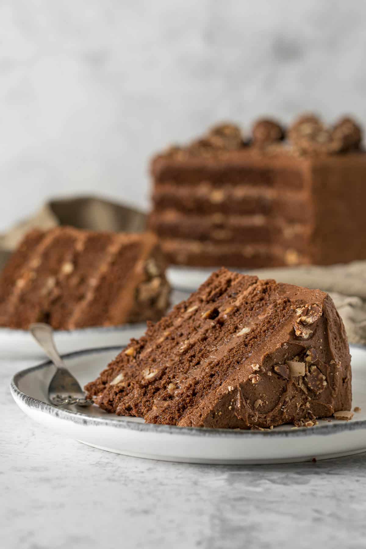 Slice of Ferrero Rocher cake on a plate.