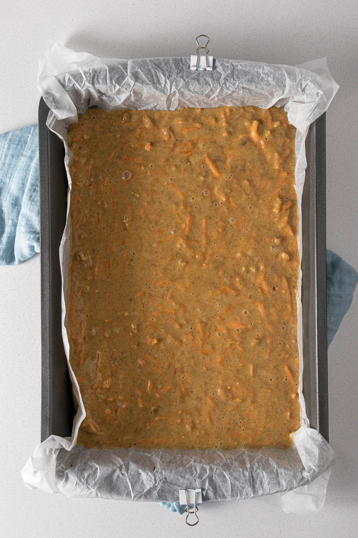 Carrot cake batter in a baking tin.
