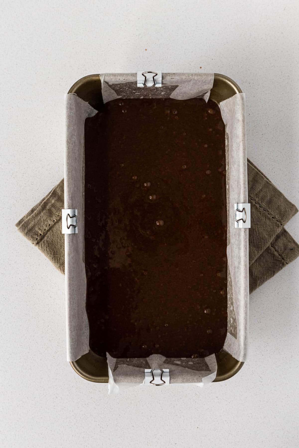 Cake batter poured into loaf tin.