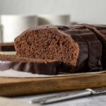 Sliced chocolate loaf cake with chocolate glaze.