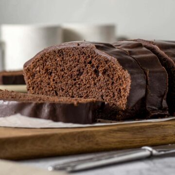 Sliced chocolate loaf cake with chocolate glaze.