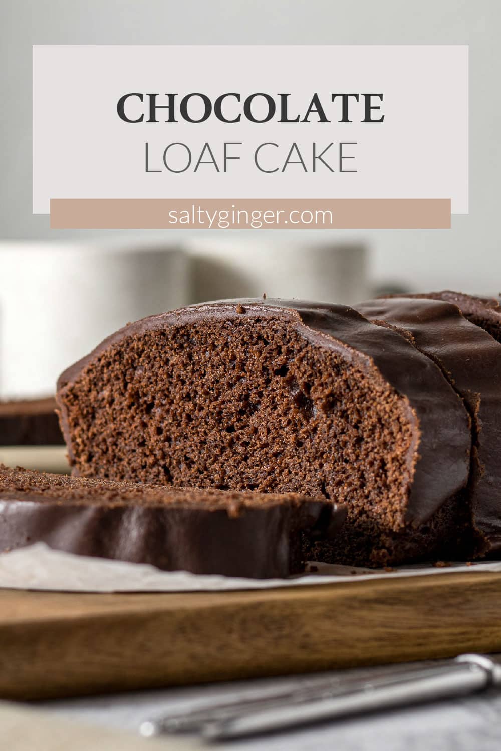 Sliced chocolate loaf cake with chocolate glaze.