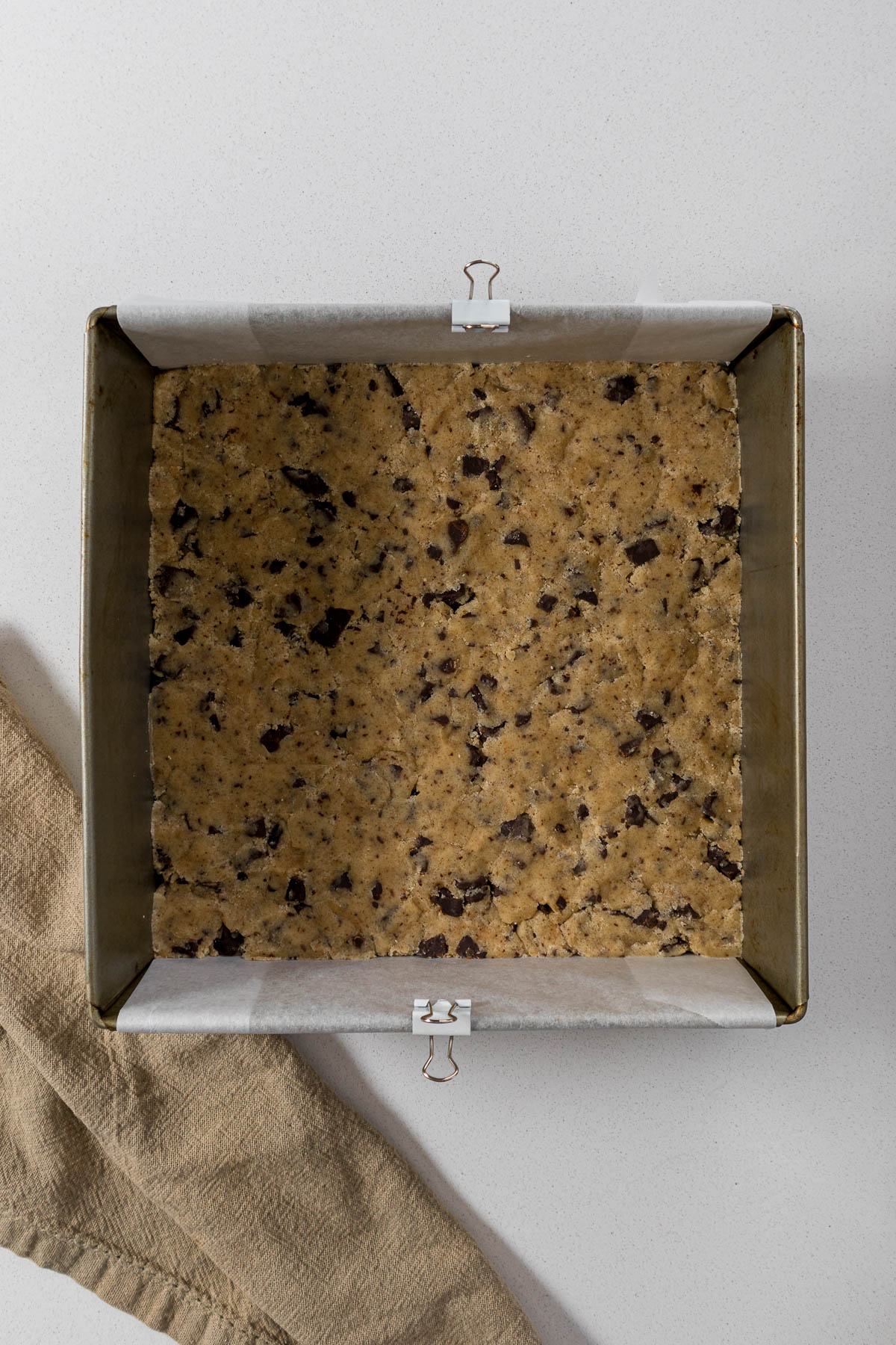 Shortbread dough pressed into tin.