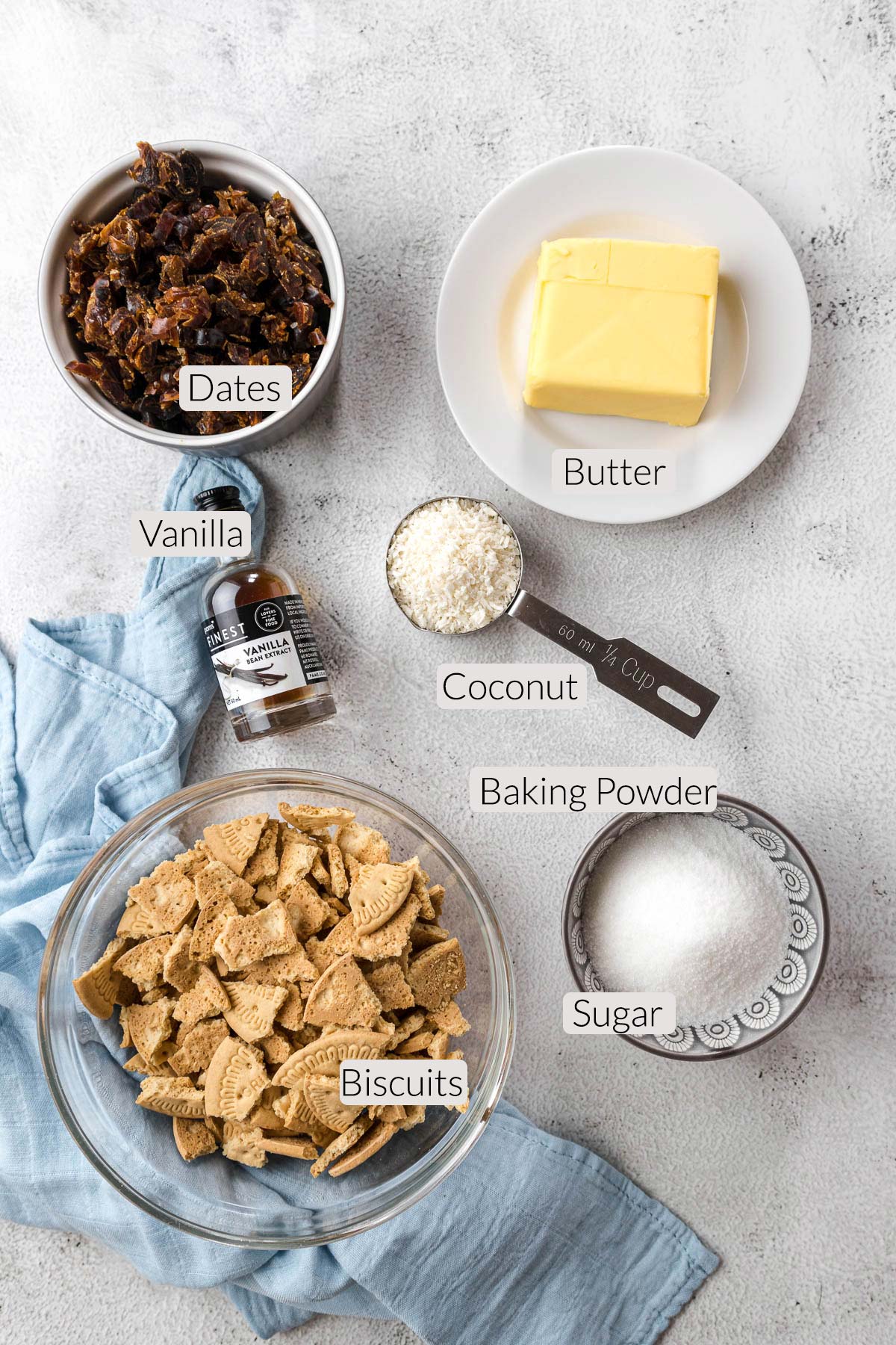 Date slice ingredients - butter, dates, coconut, biscuits, vanilla and sugar.