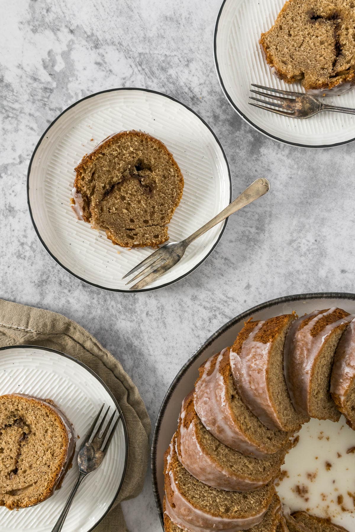 Sliced cinnamon bundt cake on a plate.