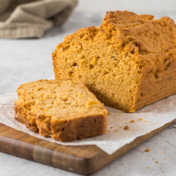 Sliced mealie bread on a cutting board.